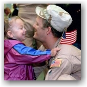 Child hugging American Veteran 